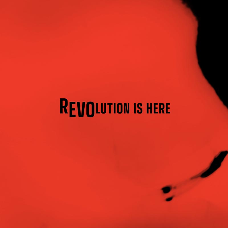 'Revolution is here' is warped sitting on a red background.